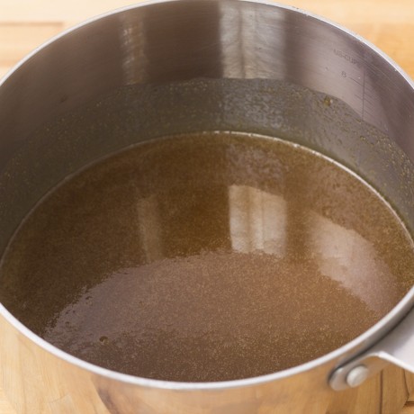 Sauce mixed and warmed in a pot.